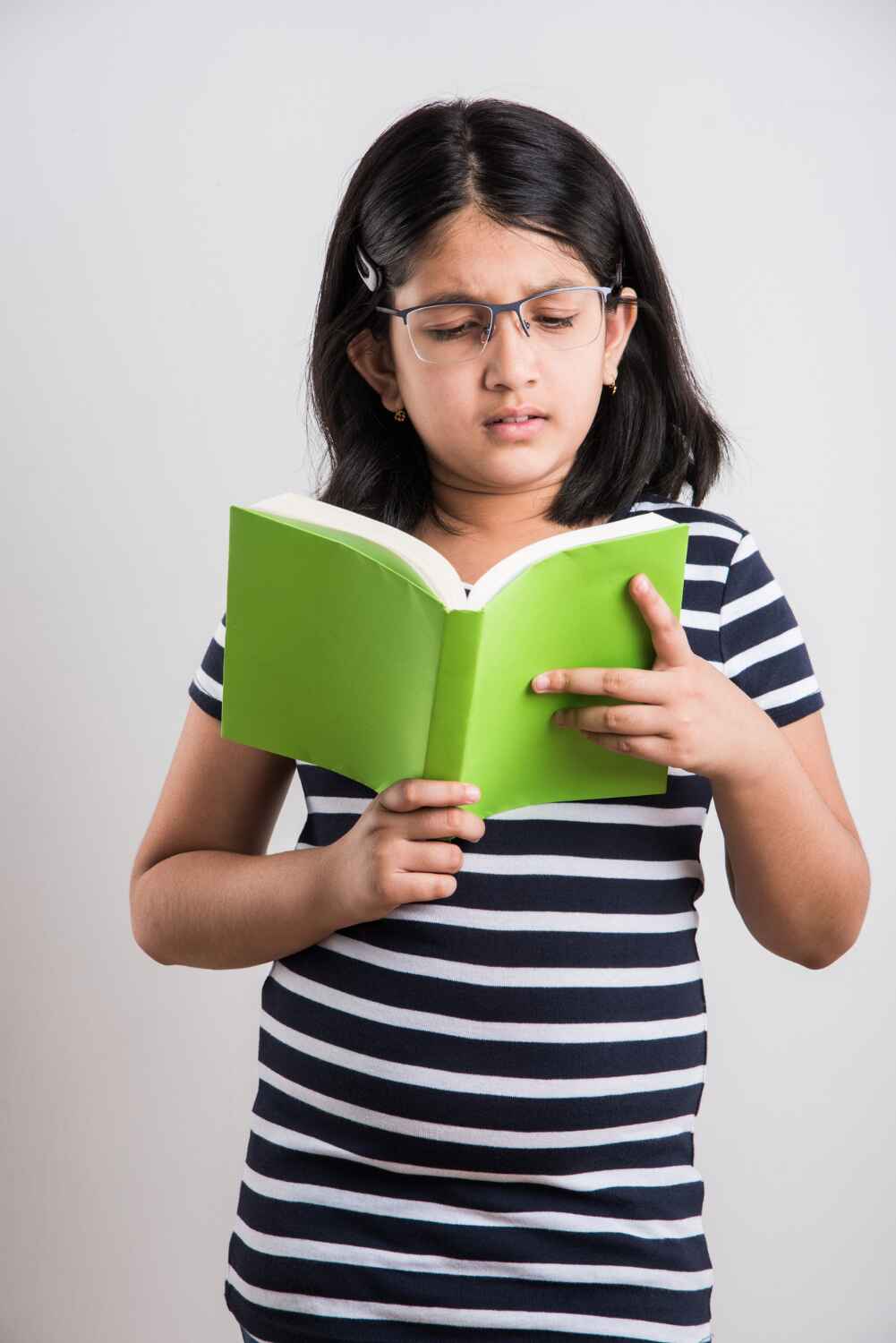 a kid reading malayalam book